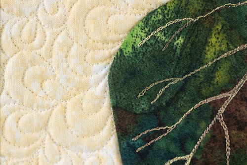 The edge of this leaf was hand appliquéd with InvisaFil™. The fine thread allows appliqué to lay flatter while disappearing perfectly.