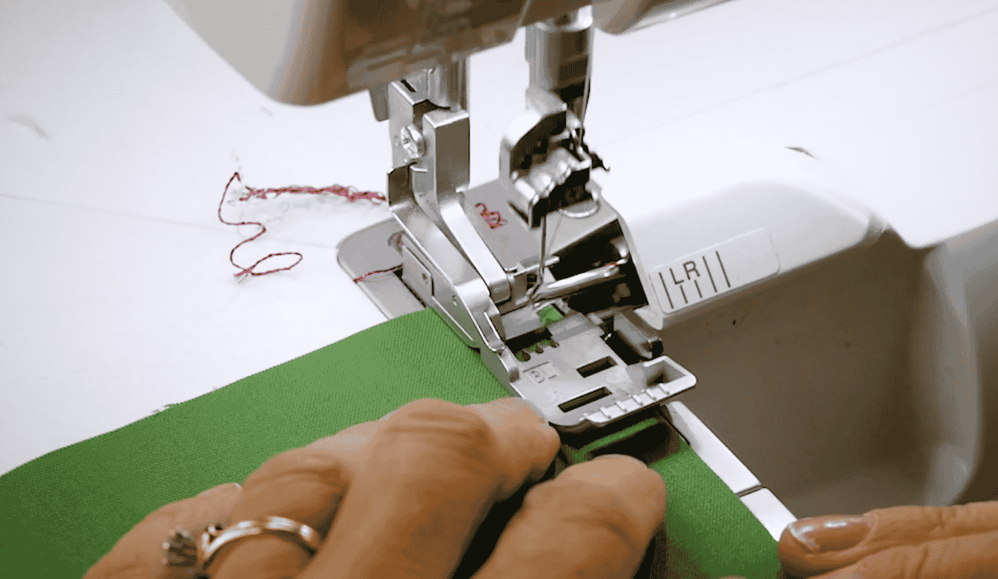 A picture containing sewing machine, person, appliance, hand

Description automatically generated