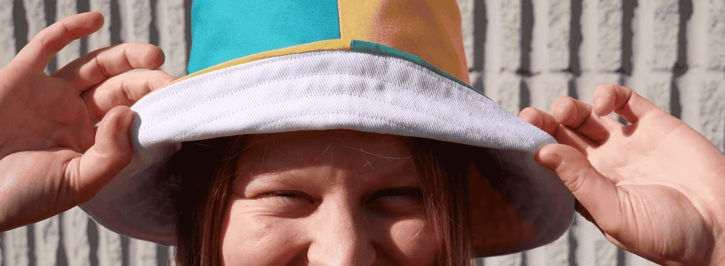 A picture containing person, headdress, hat, hand

Description automatically generated
