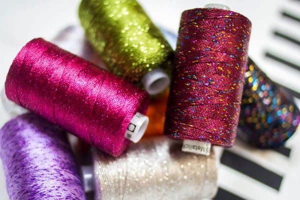 Add a new element to your projects with Dazzle™ 8wt rayon and metallic threads, available in a variety of designer colour collections and our own.
