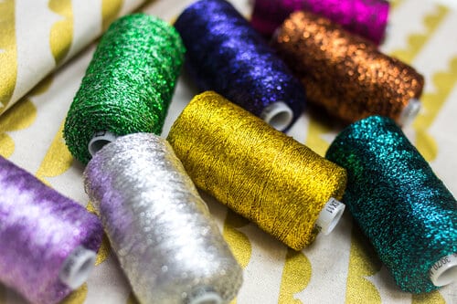Available in 13 solid colours to chose from, this rayon thread will be sure to make a statement in your projects!