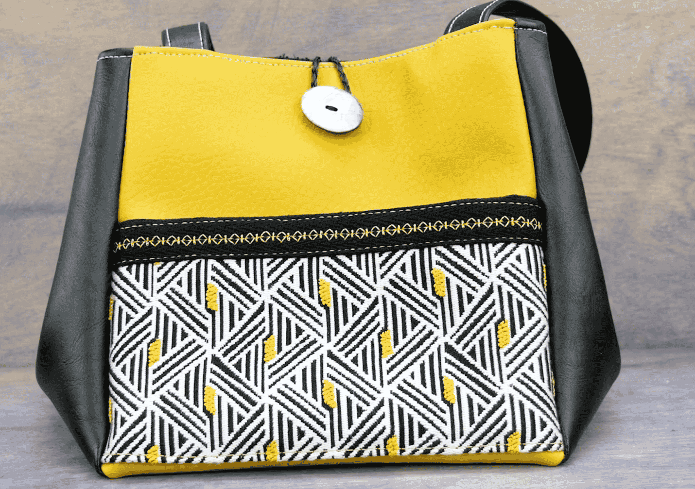 A black and yellow bag Description automatically generated