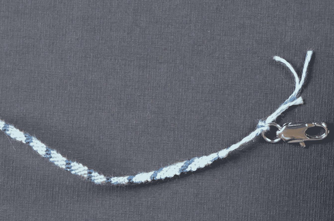 A picture containing necklace, flying, kite, knot Description automatically generated