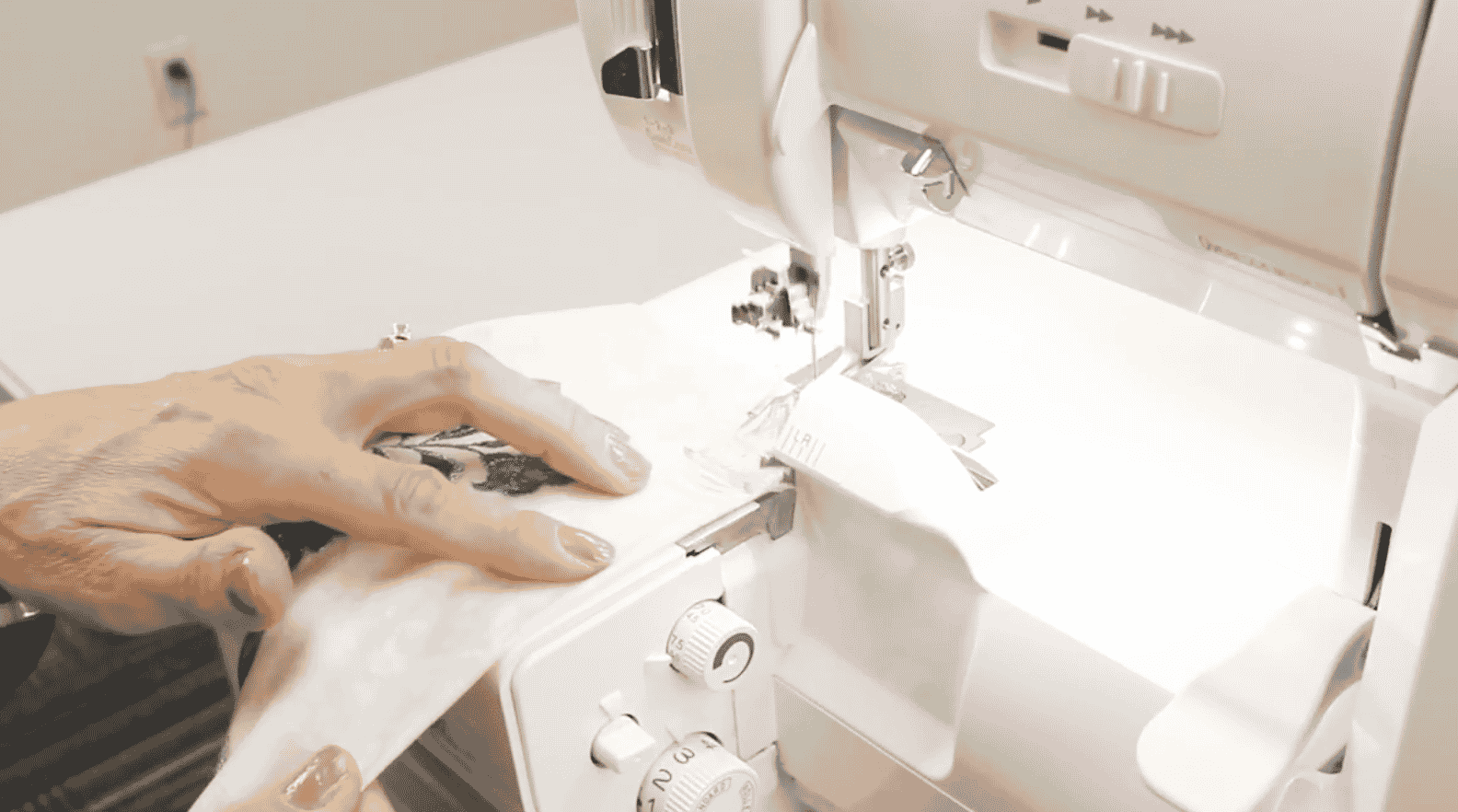 A picture containing sewing machine, appliance, indoor, person

Description automatically generated