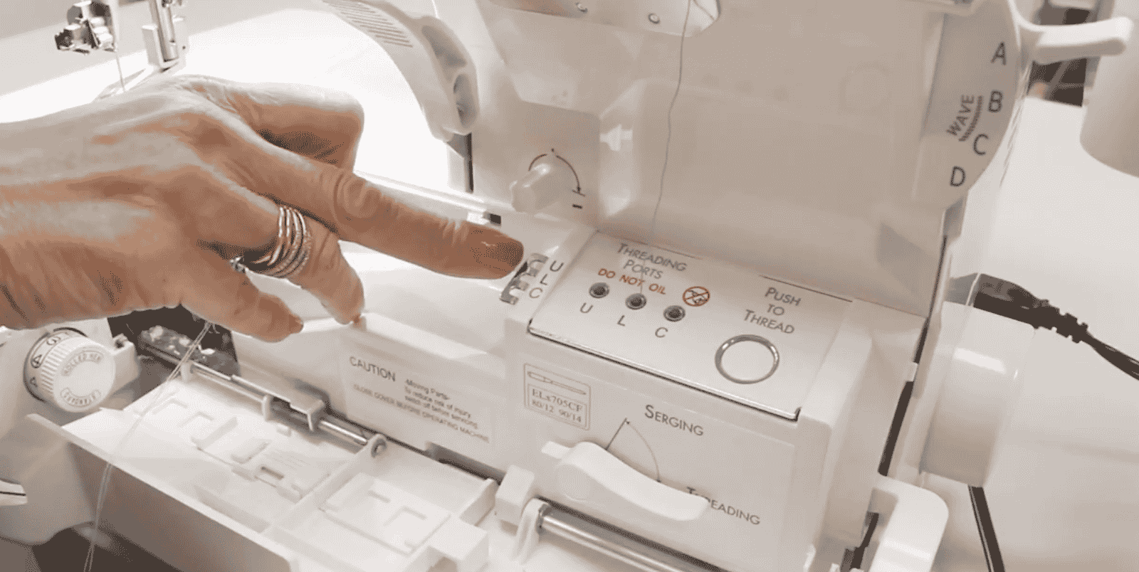 A picture containing sewing machine, indoor, appliance, person

Description automatically generated