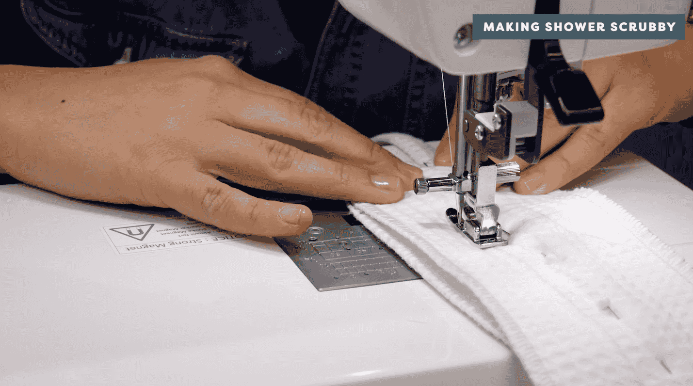 A picture containing text, sewing machine, person, appliance

Description automatically generated