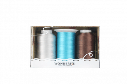 Close-up of a BOM 2025 piecing pack featuring DecoBob threads.